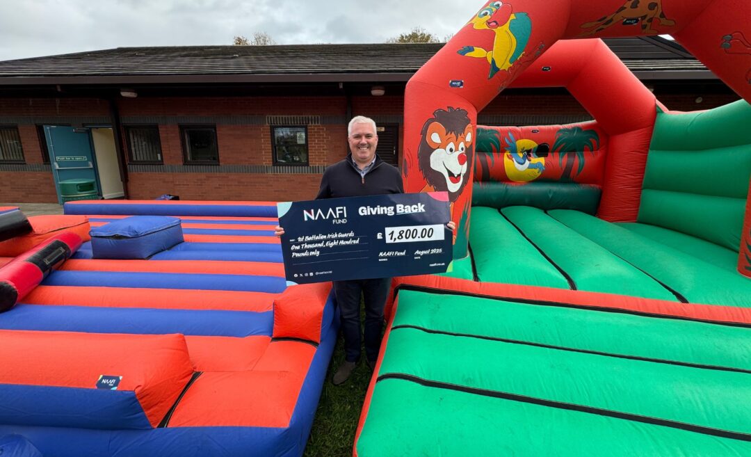 1st Battalion Irish Guards Member with a NAFI Fund Cheques Bouncy Castle